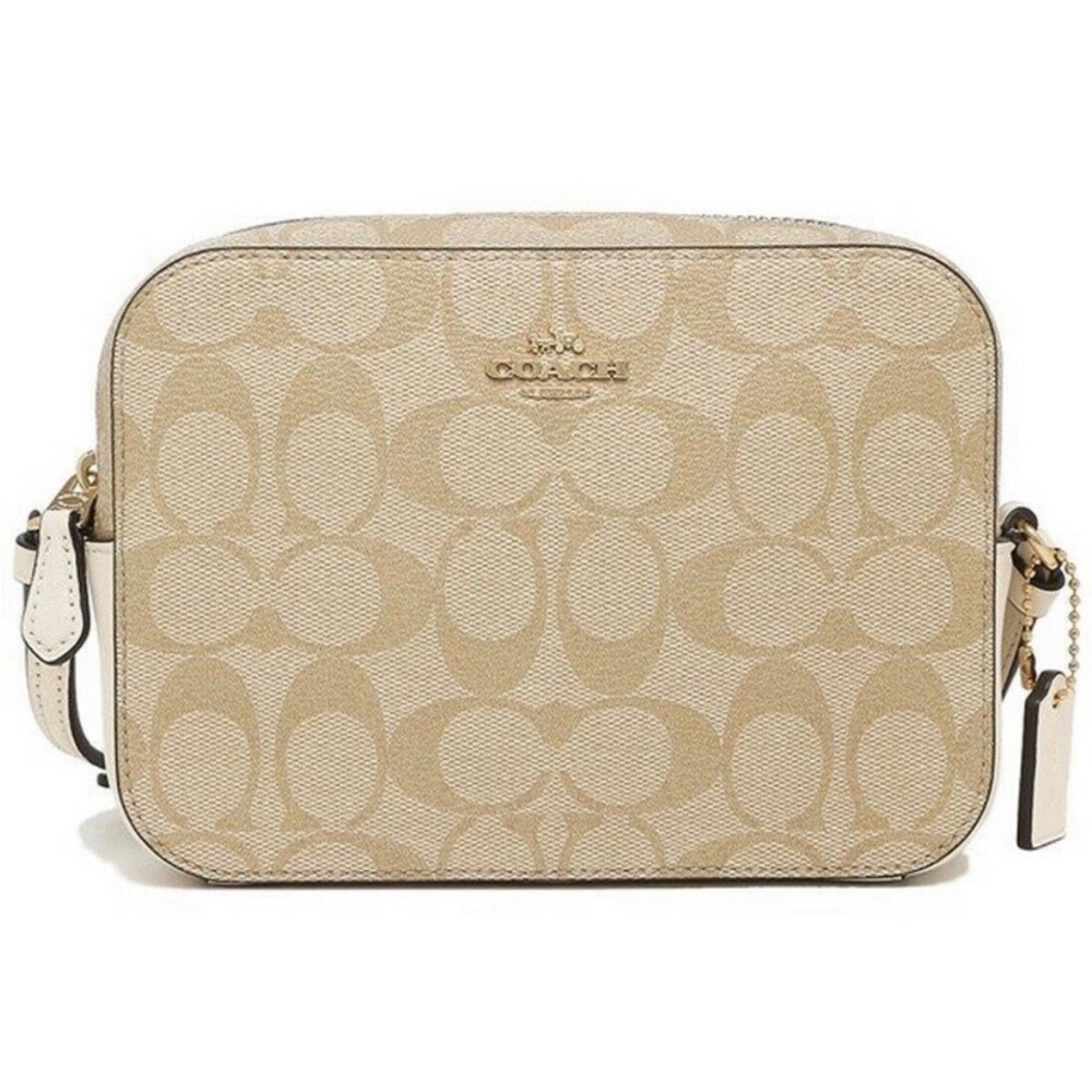 authentic mini COACH camera bag in color tan with logo. In great condition